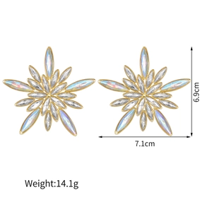 Oversized gold star earrings with iridescent crystals, measuring 6.9cm by 7.1cm
