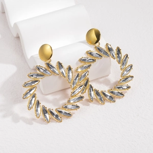 Exaggerated gold marquise-cut crystal hoop earrings for women on wave display