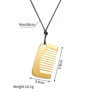 Golden comb pendant necklace in stainless steel with black woven cord and dimensions