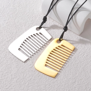 Silver and gold comb pendant necklace in polished stainless steel on white stone