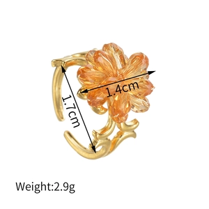 Adjustable gold stainless steel ring with orange crystal beaded flower design