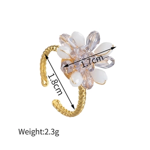 Elegant adjustable gold flower ring with crystal beads and twisted braided band design