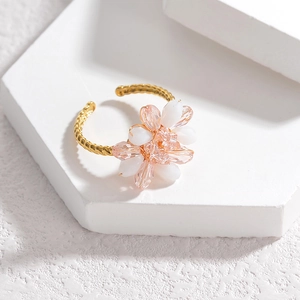 Floral crystal bead open ring in pink and white with a gold braided adjustable band