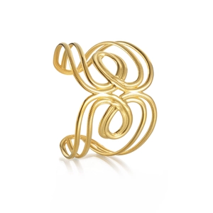 Gold wide cuff bracelet with intricate hollow spiral patterns in punk geometric style