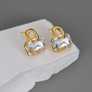 Elegant gold-plated geometric earring set with clear rectangular zircon on white stone