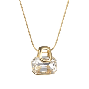 Minimalist gold necklace with a large rectangular clear crystal pendant and snake chain