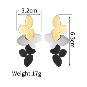 Detail view of asymmetrical floral earrings with 6.3cm length and 3.2cm width dimensions