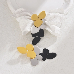Three-tone layered floral tassel earrings with matte black, silver, and gold finish
