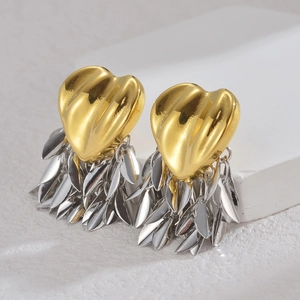 Minimalist heart-shaped tassel earrings in gold and silver finish on display stand