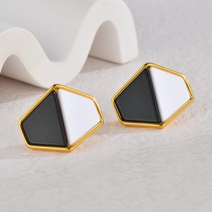 Modern geometric stud earrings with black and white enamel finish and gold metal frame