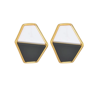 Modern geometric hexagonal stud earrings with black and white enamel and gold metal frame