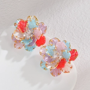 Colorful acrylic flower earrings with gold edges and crystal center on display stand