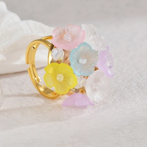Floral open ring with colorful pastel resin flowers on a delicate gold adjustable band