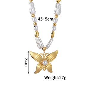 Baroque pearl necklace with large gold butterfly pendant and dimensions on white background