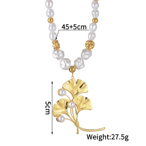 Detailed view of ginkgo leaf pendant with pearls on 45+5cm gold beaded necklace
