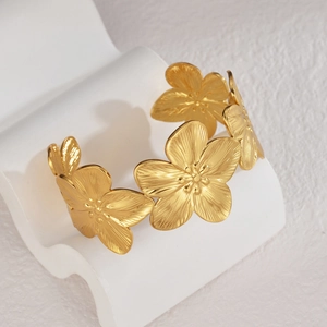 Elegant gold-plated open cuff bracelet with hollow floral design and matte finish