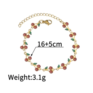 Detail of cherry bracelet showing 16+5cm length and cherry charms with red glitter