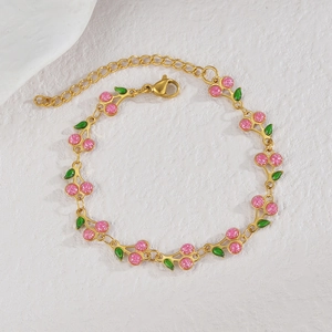 Pink glitter cherry charm bracelet in gold stainless steel with adjustable chain links