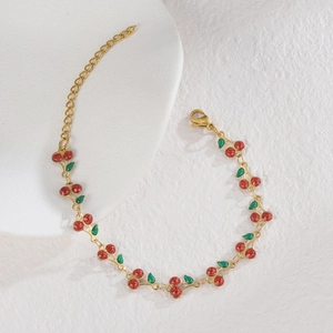 Girl's cherry charm bracelet in gold stainless steel with red glitter resin pendants