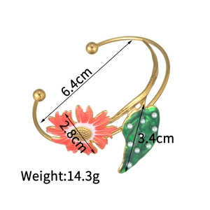 Detail view of floral bangle featuring red daisy and green leaf with dimensions and weight