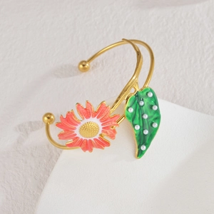 Floral open bangle with pink enamel daisy and pearl leaf on gold stainless steel