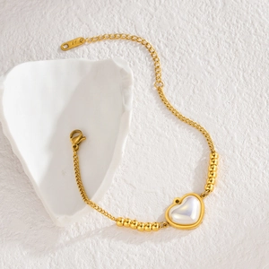 Bracciale vintage dorato con cuore in madreperla e catena regolabile fine