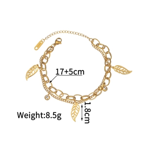 Detailed view of 18KGP double-layered bracelet with leaf charms and crystal accents