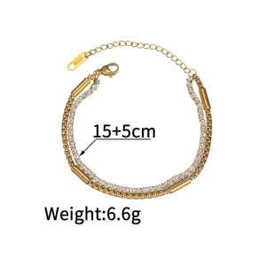 Detail of double-layer gold chain bracelet with 18KGP tag and crystal stone inlay