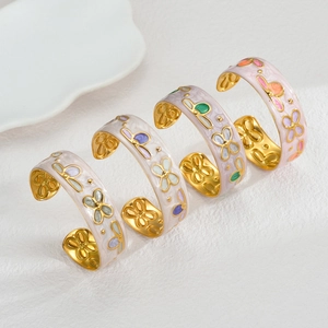 Vintage floral enamel open cuff bracelets with gold plating in a four-piece jewelry set