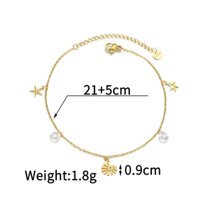 Detail of 18K gold titanium steel anklet featuring star and sun charms with cz drops
