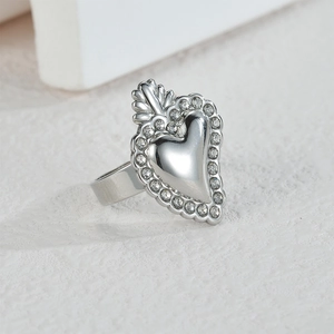 Silver stainless steel heart ring with sparkling rhinestone border and wide band