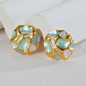 Artistic irregular gold earrings with light blue, teal, and white enamel inlay