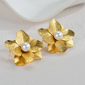 Golden 3D flower stud earrings with matte metal petals and centered white pearl