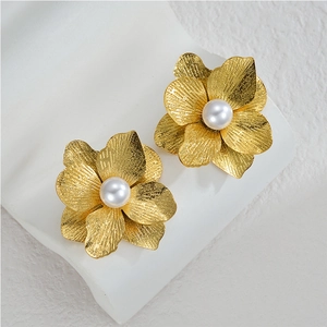 Exaggerated golden flower stud earrings with brushed texture and central white pearl
