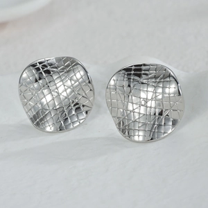 Minimalist silver stainless steel stud earrings with irregular concave grid pattern design