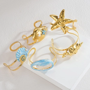 5-piece gold ocean series bracelet set with sea shells, starfish and pearls on stones