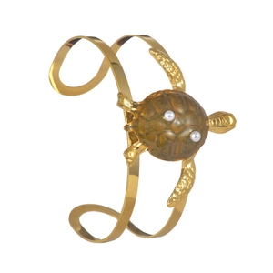 Gold open cuff bracelet featuring sea turtle motif with pearls and green shell detail