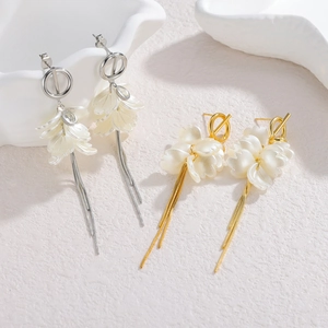 Long tassel flower earrings in gold and silver finish with elegant white resin petals