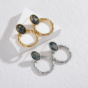 Retro twisted metal hoop earrings with black agate studs in gold and silver finish