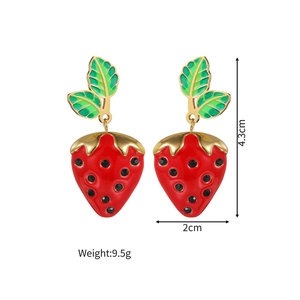 Detail view of red enamel strawberry earrings with green leaves and dimensions