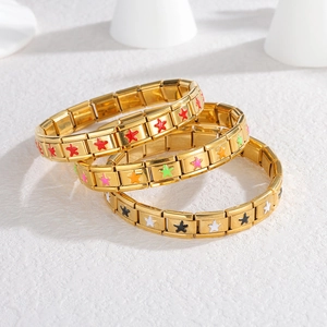 Three-piece gold Italian charm bracelets with colorful enamel star charms on white background