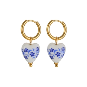 Elegant gold-plated heart-shaped white ceramic earrings with blue floral pattern