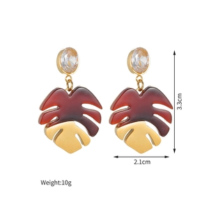 Close-up of monstera leaf earrings with cubic zirconia stud and size specifications
