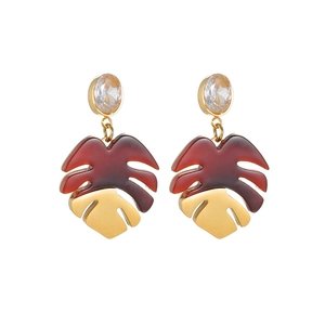 Elegant gold and resin leaf earrings with sparkling zircon stud in a minimalist style