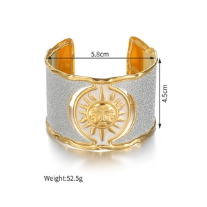 Detail view of sunflower steel cuff with size markings 5.8cm diameter and 4.5cm width