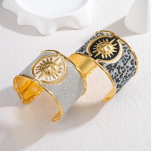 Bohemian gold plated sun relief bangles featuring leopard print and silver glitter designs