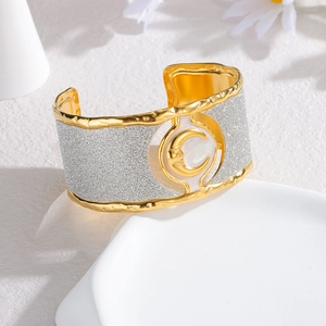 Vintage wide gold-plated leopard bangle with crescent moon relief and marble inlay