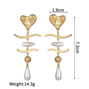 Detailed view of heart pearl tassel earrings with dimensions 1.9cm width and 7.3cm height