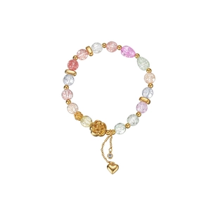 Colorful beaded tassel bracelet with rose charm and heart pendant on white background