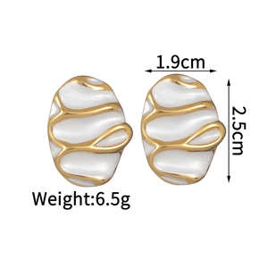Detail showing dimensions of white oval enamel earrings with gold wave pattern